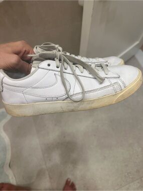 Nike White Leather Sneakers with Beige Soles and Gray Laces